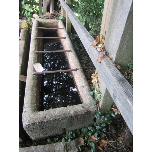 69 - A weathered reconstituted feeding trough, 170cm x 45cm