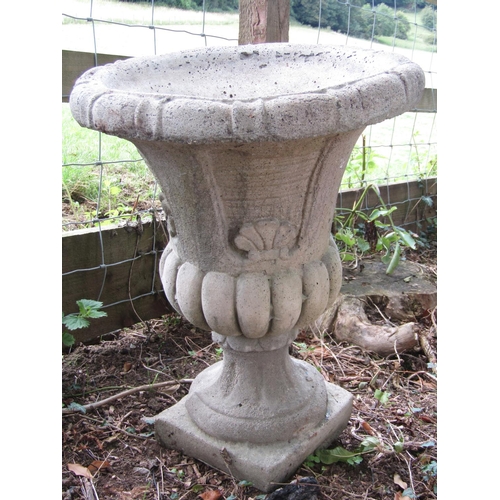 89 - A reconstituted fluted urn, square cut planter, another and a moulded square cut plinth