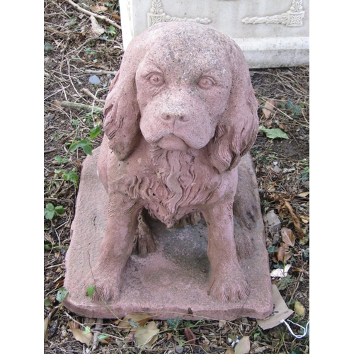 96 - A weathered garden figure in the form of a seated spaniel, with terracotta coloured finish, 50cm hig... 