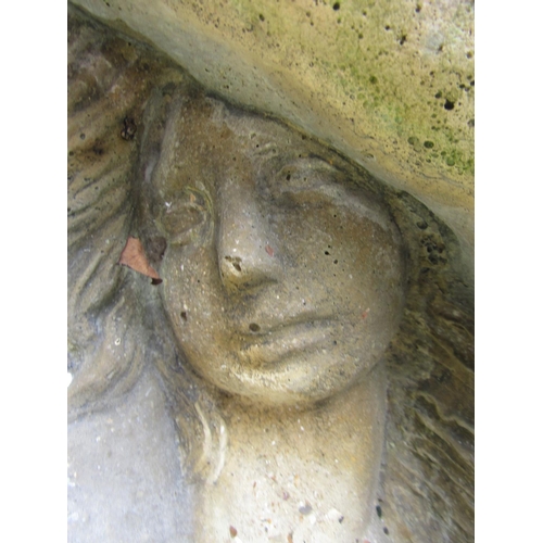 148 - A weathered reconstituted figure of a shy maiden, 115cm high