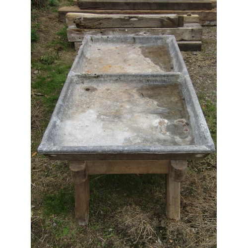 152 - A 19th century two divisional lead lined salting trough, raised on a pine frame, 155 x 85cm