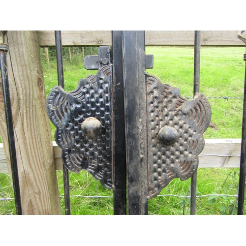 155 - A pair of wide steelwork entrance gates, with decorative spearhead finial detail, 3.8m wide, 1.7cm h... 