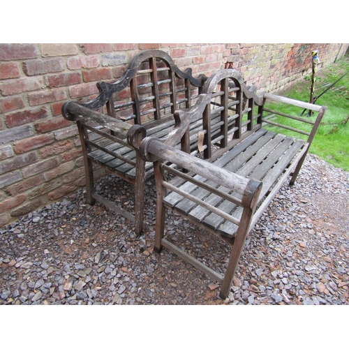 165 - A pair of weathered garden benches in the manner of Lutyens, 170cm long