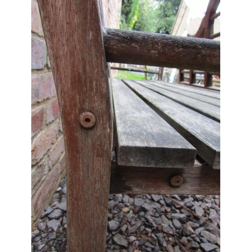 165 - A pair of weathered garden benches in the manner of Lutyens, 170cm long