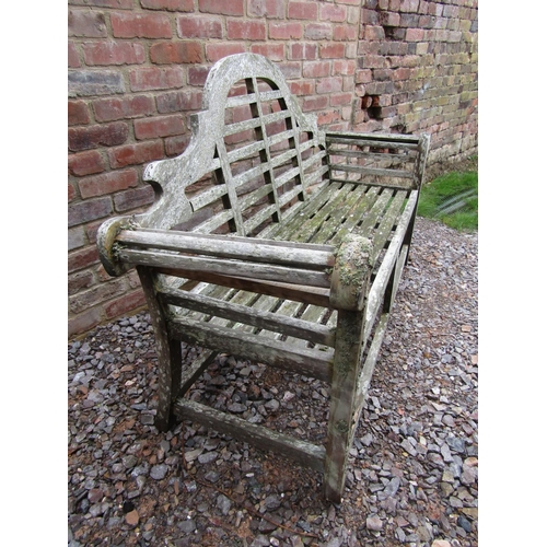 166 - A small weathered teak bench in the manner of Lutyens, 180cm long