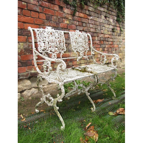 170 - Small weathered aluminium garden bench with pierced detail, raised on shaped supports, 95cm wide