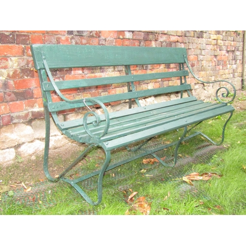 172 - A sprung steel and timber lathe garden seat, 150cm long