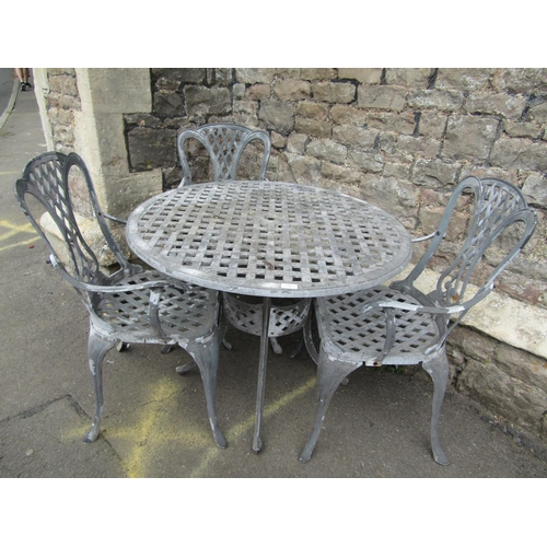 201 - A decorative aluminium terrace table with lattice work top, together with three matching chairs