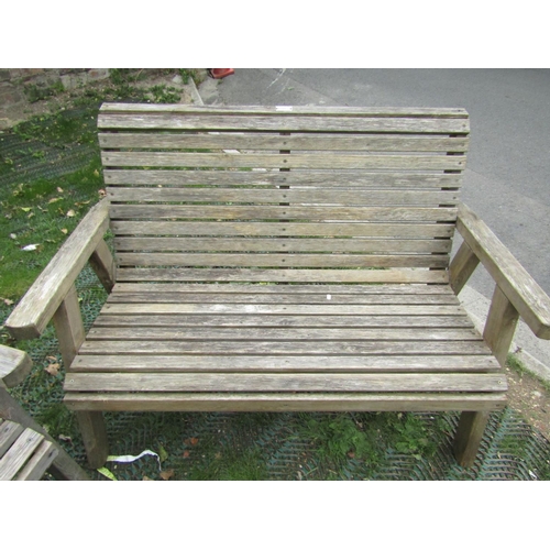 203 - A pair of weathered pine slatted garden benches by Riverco, 130cm long