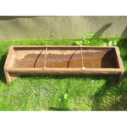 181 - A small cast iron feeding trough, 92cm long