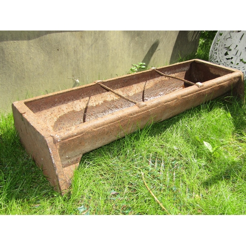 181 - A small cast iron feeding trough, 92cm long