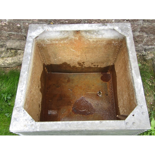 183 - A galvanised iron water tank of cubic form with riveted detail, 62cm square