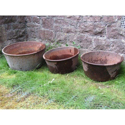 184 - Two graduated cast iron feeders, circular form, 50cm diameter and smaller