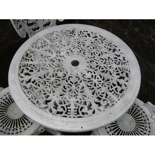 187 - A decorative cast aluminium terrace table of circular form, together with three chairs