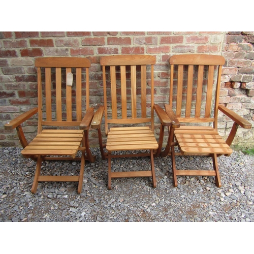 194 - Three unused teak wood garden loungers by F Peart & Co