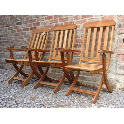 194 - Three unused teak wood garden loungers by F Peart & Co