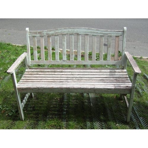 199 - A light weight weathered teak cottage garden bench, with slatted seat and back, painted finish, 125c... 