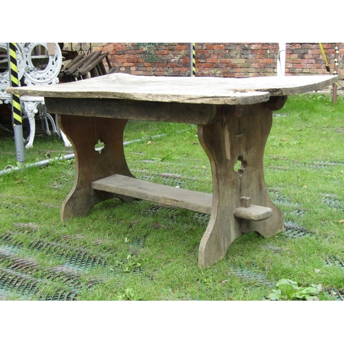 204 - A small rustic elm occasional table with shaped supports and quafoil pierced detail, 120cm long