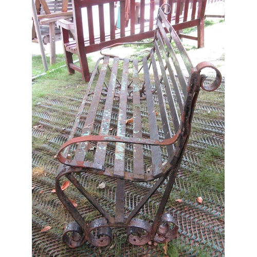 209 - A vintage sprung steel bench on scrolled supports, 182cm long