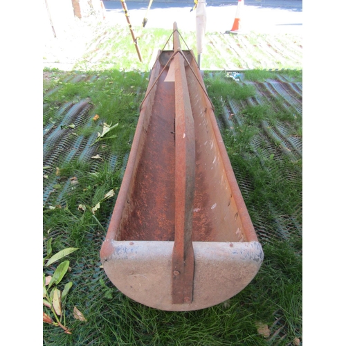 177 - A vintage galvanised iron sheep feeding trough, with central bar and single axle, 275cm long