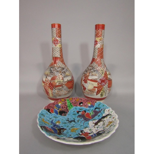 669 - A pair of tall early 20th century Satsuma bottle shaped vases with drawn necks and painted male char... 