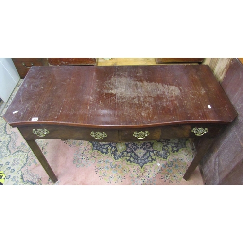 2200C - A Georgian style mahogany side table  the serpentine front fitted with two frieze drawers raised on ... 