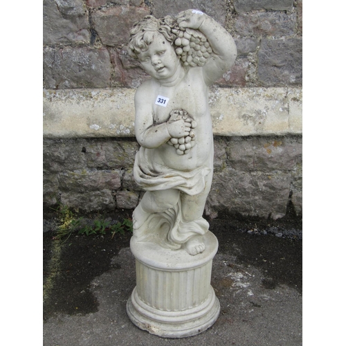 1706 - A garden figure of a cherub holding fruiting vines, raised on a circular fluted plinth, 83cm high