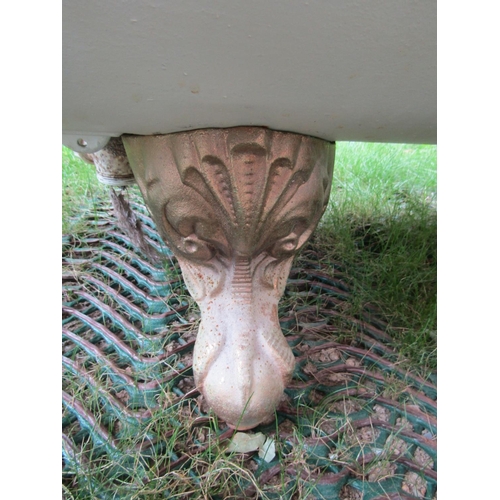 1666 - A Victorian cast iron and enamel roll top bath with gilt painted claw and ball feet