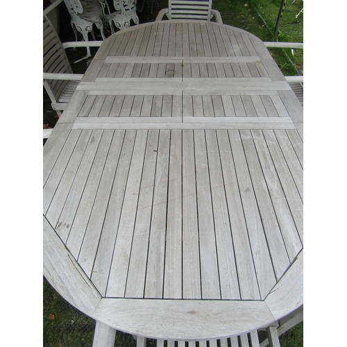 1674 - A contemporary weathered (silvered) teak D end pull out extending garden table with slatted top, bi-... 