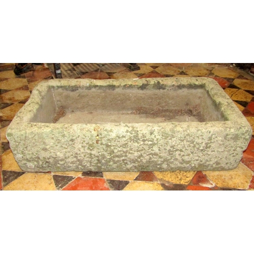 1687 - A weathered natural stone trough of rectangular form, 72 cm long x 38 cm wide x 18 cm deep