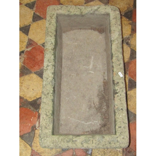 1687 - A weathered natural stone trough of rectangular form, 72 cm long x 38 cm wide x 18 cm deep