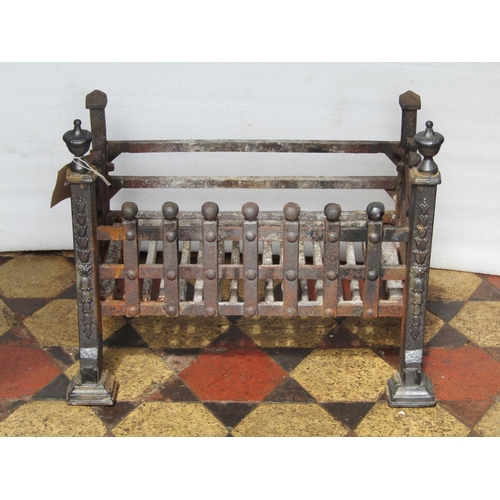 1696 - A cast iron fire basket of rectangular form with lattice surround and urn shaped finials, 54 cm wide... 