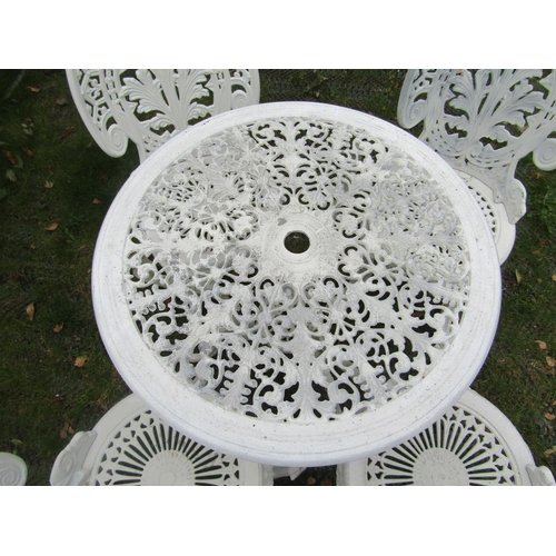 1662 - A cream painted cast aluminium garden terrace table of circular form with decorative pierced top and... 