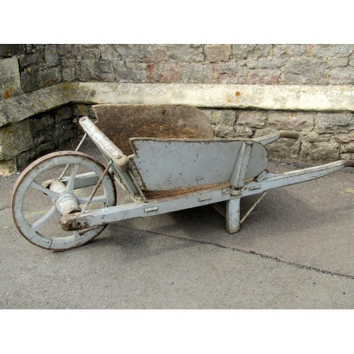 1663 - An old traditional wooden wheelbarrow with through jointed and chamfered frame, timber spoke wheel w... 