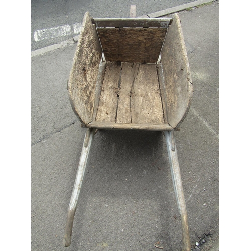 1663 - An old traditional wooden wheelbarrow with through jointed and chamfered frame, timber spoke wheel w... 