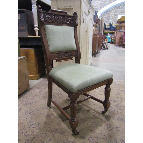 1815 - A set of six Victorian oak dining chairs with sage green dralon upholstered seats and back pads with... 