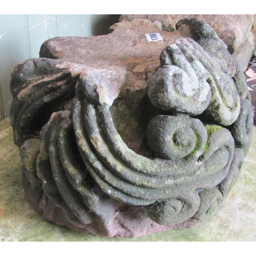 1708 - A weathered natural stone corbel with deep carved scrolling foliate detail, 38 cm in diameter approx