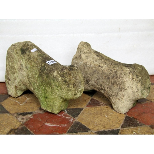 1709 - A pair of well weathered naive carved stone lions, 36 cm long x 22 cm in height