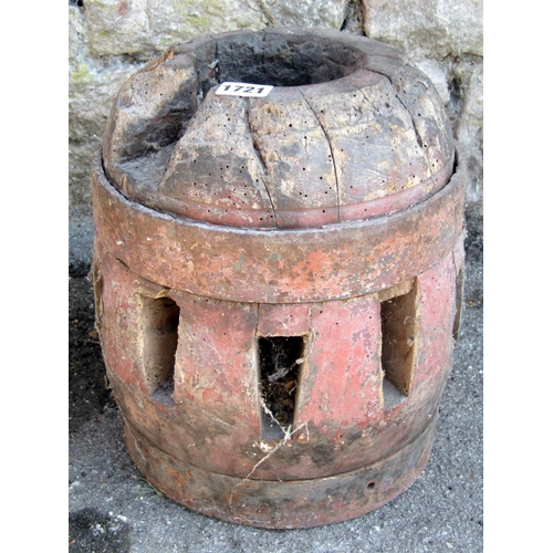 1721 - A 19th century wooden and steel banded cart hub with traces of original painted finish