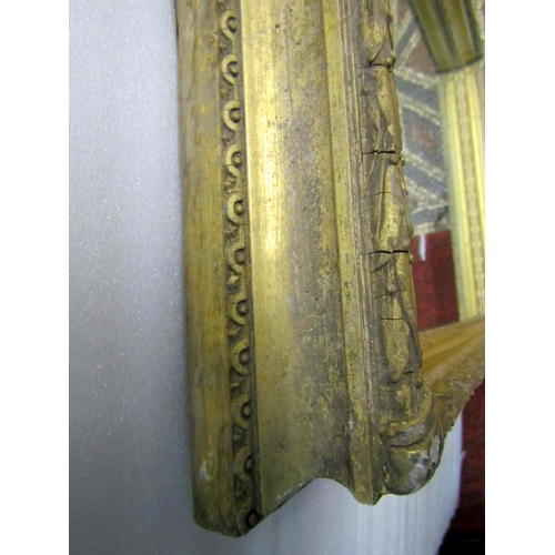 1759 - A 19th century stepped and moulded gilt frame of rectangular form with split beaded slip, foliate su... 