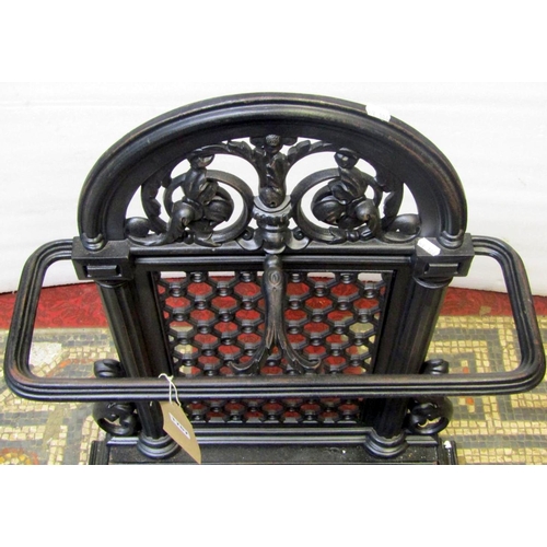 1767 - A Victorian cast iron two divisional umbrella stand with arched and pierced lattice back and removab... 