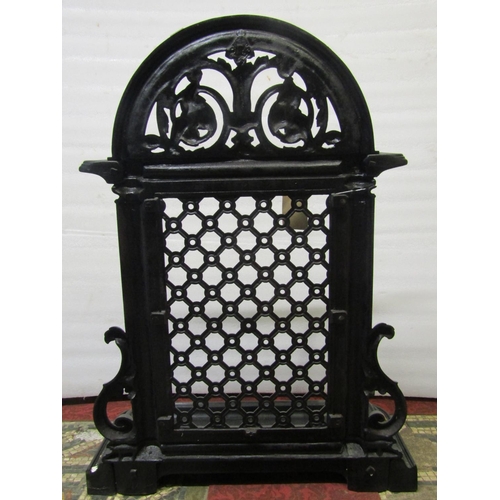 1767 - A Victorian cast iron two divisional umbrella stand with arched and pierced lattice back and removab... 