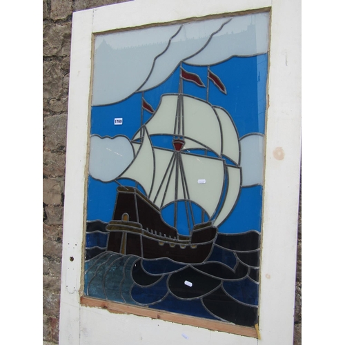 1769 - A reclaimed 1930s painted pine door, partially enclosing a coloured leaded light panel of a galleon ... 