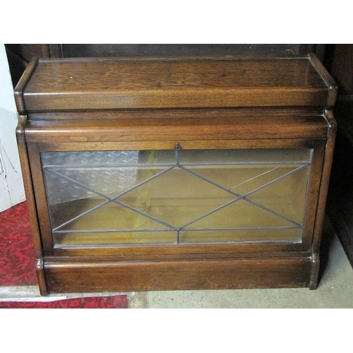 1770 - An early 20th century oak floorstanding two sectional library bookcase enclosed by rectangular leade... 