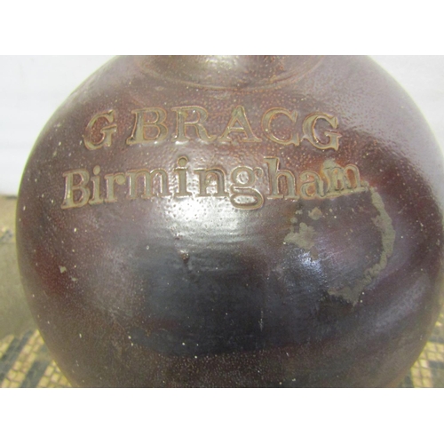 1772 - A 19th century salt glazed stoneware flagon with impressed merchants mark for G Bragg, Birmingham, 5... 