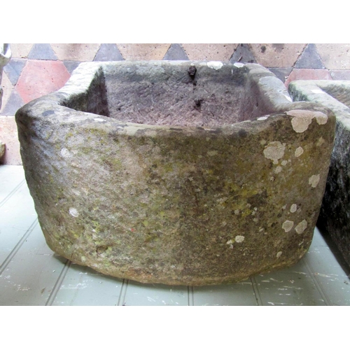 1713 - A weathered natural stone trough of rectangular form with single D end, 64 cm long x 48 cm wide x 28... 