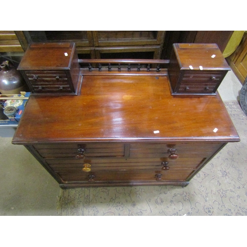 1789 - An Edwardian mahogany dressing chest of two long and two short drawers beneath further trinket drawe... 