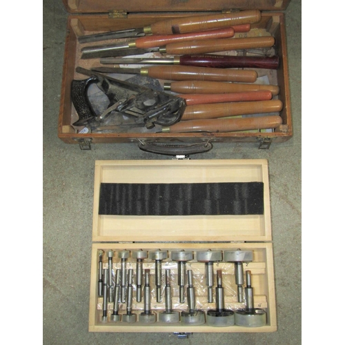 1808 - A portable wooden and board portable tool chest containing various long handled woodworking chisels,... 