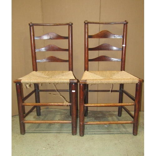 1827 - A set of four 19th century ash-wood country dining chairs with graduated ladder-backs over  rush sea... 