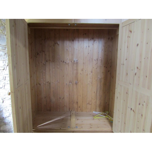 1834 - A Victorian style stripped pine wardrobe enclosed by a pair of three quarter length quarter moulded ... 